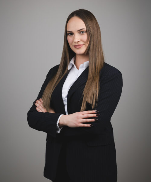 Person seated at law firm desk.